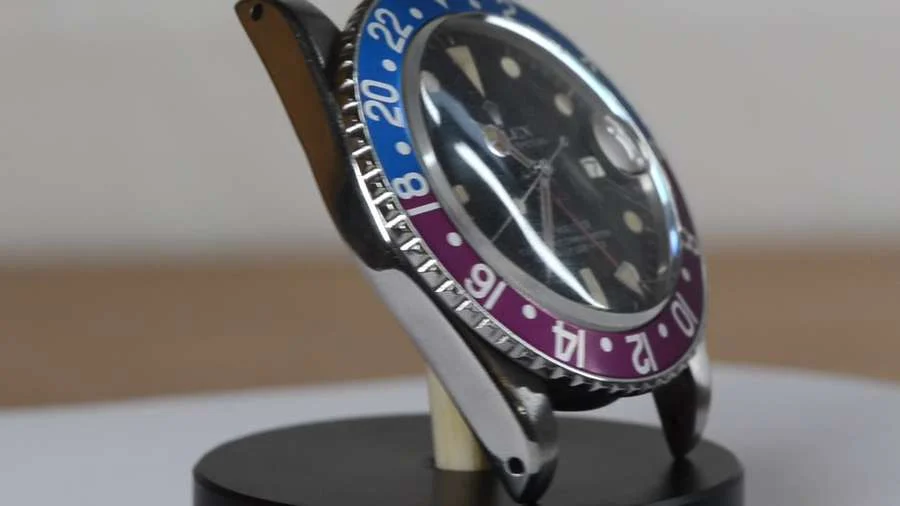 GMT-Master 1675 before case restoration, shown on a workshop turntable