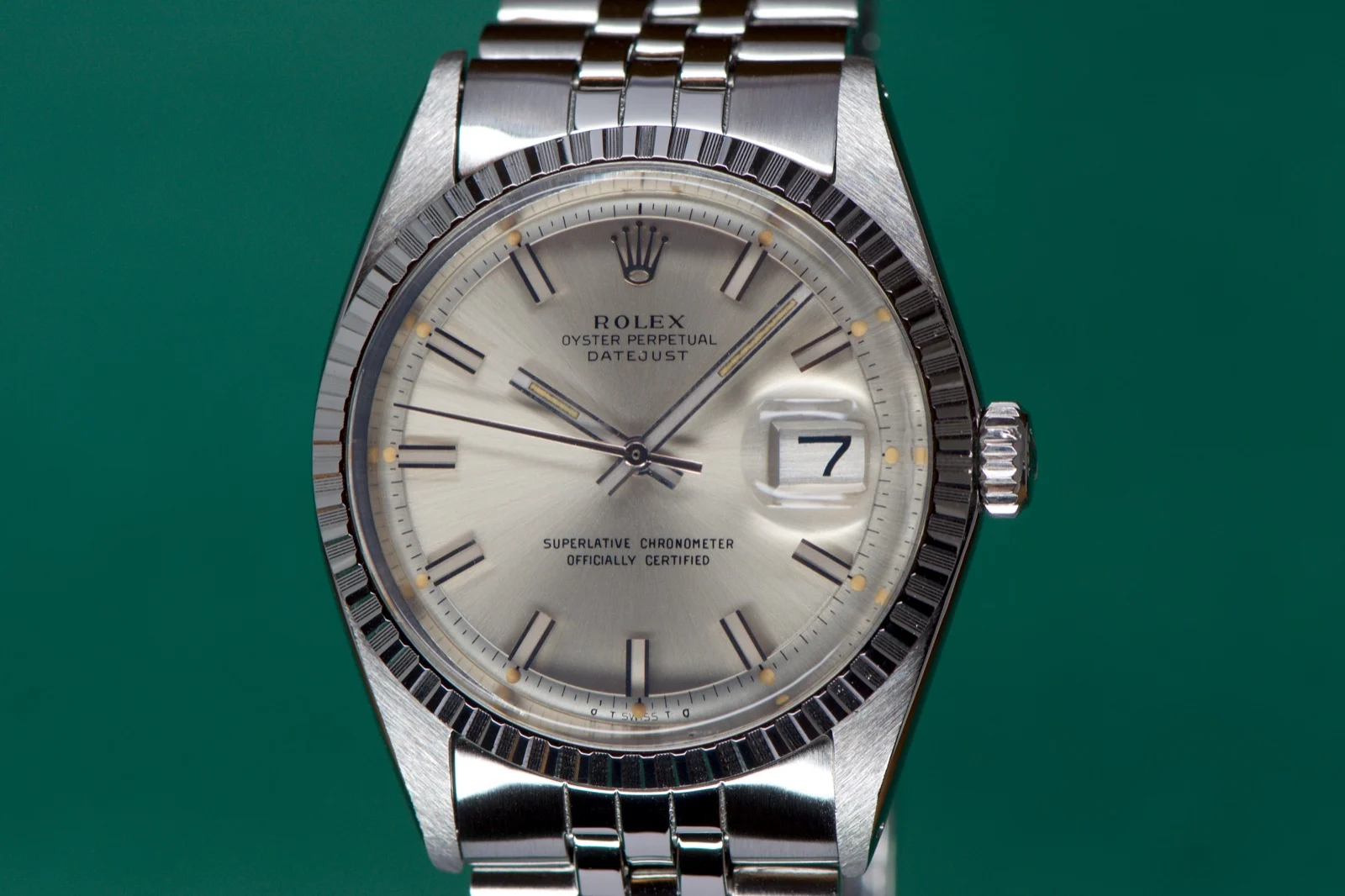 Silver-dial Rolex Datejust with a steel bracelet.