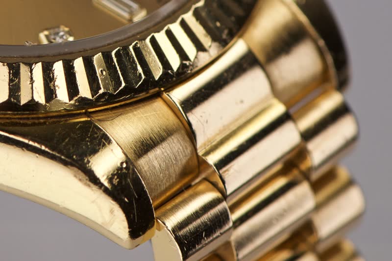 Rolex Day-Date fluted bezel and President links before, dinged and scratched