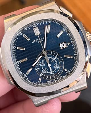 Patek Nautilus Anniversary after bezel laser work, brushing restored
